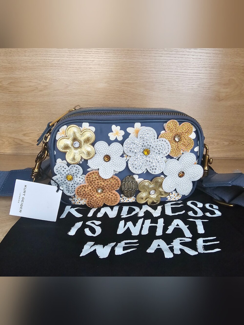 Kurt Geiger London Kensington crossbody  gold and tan floral appliqués.